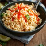 image that showcases a bowl filled with perfectly cooked, fluffy Mexican rice.