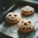 A variety of colorful Halloween sweet treats, including candies and desserts.