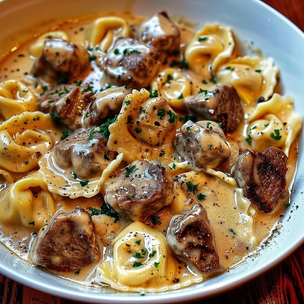 Cracked Garlic Steak Tortellini served in a bowl with garlic and herbs