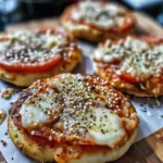 High protein pizza bagels topped with cheese and sauce