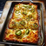 Freshly baked easy cheesy jalapeno bread with melted cheese and jalapenos