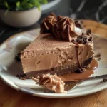 Delicious no-bake Nutella cheesecake topped with chocolate swirls