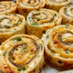 Delicious simple jalapeno popper pinwheels ready to serve.