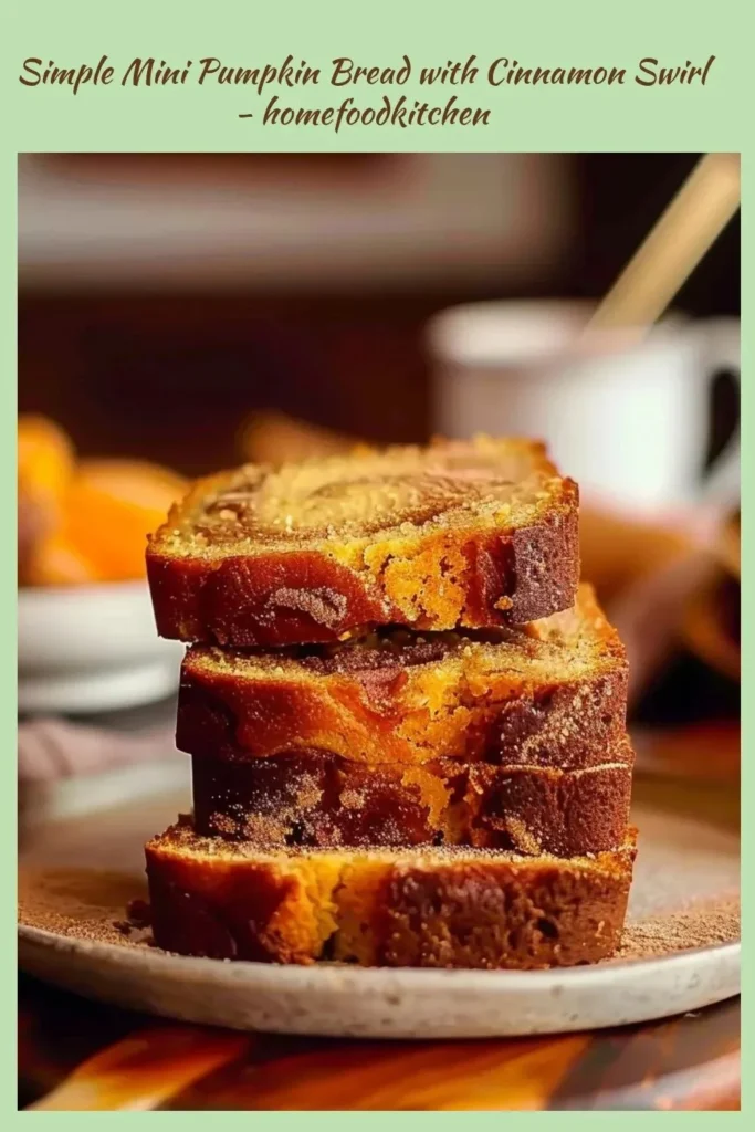 Mini pumpkin bread with cinnamon swirl, freshly baked and sliced