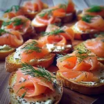 Smoked salmon and dill crostini appetizer on a decorative plate
