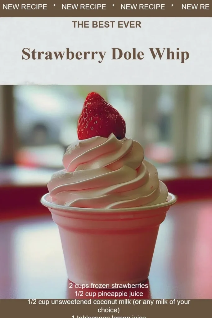 Delicious strawberry dole whip served in a cup with fresh strawberries on top.