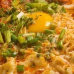 Budae Jjigae - savory Korean army stew with meat, vegetables, and noodles