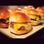 Hawaiian Roll Cheeseburger Sliders served on a plate