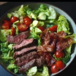 BLT Steak Salad with grilled steak, crispy bacon, and fresh vegetables