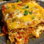Delicious homemade taco lasagna with layers of beef, cheese, and tortillas