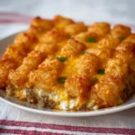 Delicious Tater Tot Casserole topped with melted cheese and crispy tater tots