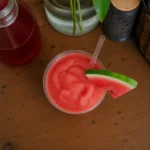 Refreshing watermelon slushies served in a clear glass with ice
